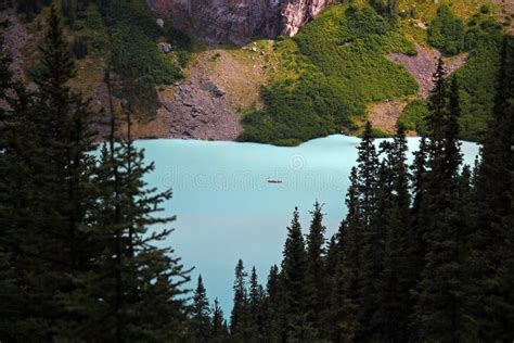 The Heart Shaped Turquoise Lake Louise With The Trees Around Stock