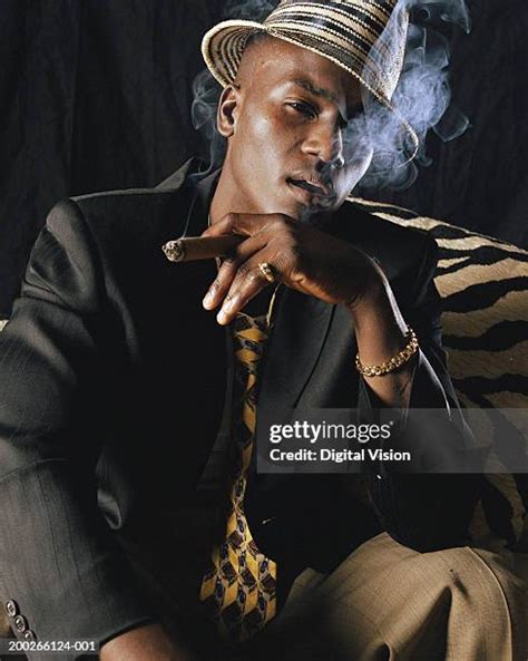 Black People Smoking Cigars Photos And Premium High Res Pictures