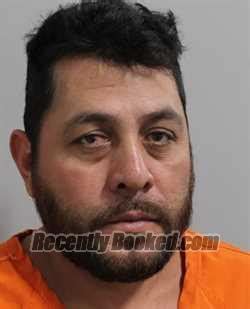 Recent Booking Mugshot For OSCAR MENDOZATORRES In Polk County Florida