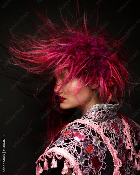 Fashion female portrait with avantgarde hair style at black background ...