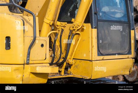 Closeup Detail Of A Working Used Dirty Yellow Excavator Centered On