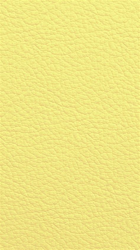 A Yellow Leather Texture Background That Looks Like It Has Been Used As