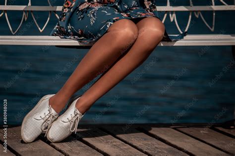 Shiny Nude Pantyhose On A Beautiful Woman Legs Girl On A Bench Stock