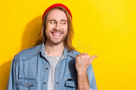 Portrait Of Cheerful Positive Man With Bob Haircut Wear Denim Jacket Looks Directing At Empty