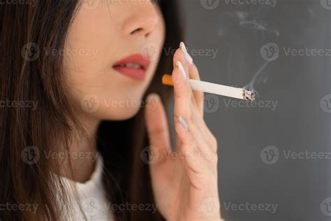 Close Up Hand Holding Cigarette Asian Woman Smoking Outdoors