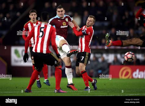 Burnleys Sam Vokes Shoots At Goal Under Pressure From Sunderlands