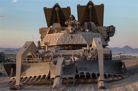 Soldiers position their M1150 assault breacher vehicle during a live ...