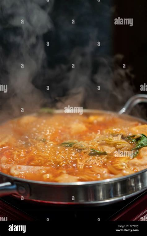 Korean Hot Pot Ramyeon And Tteokbokki In Kimchi Soup With Vegetable And Meat Stock Photo Alamy