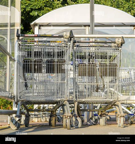 Shopping Trolleys Linked Together In The Trolley Bay Of A Uk