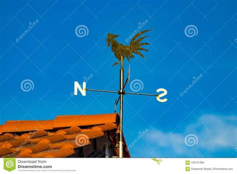 Close Up Detail View Of Weather Vane On Roof Of House Stock Photo