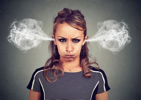 Closeup Portrait Of Angry Young Woman Blowing Steam Coming Out Of Ears