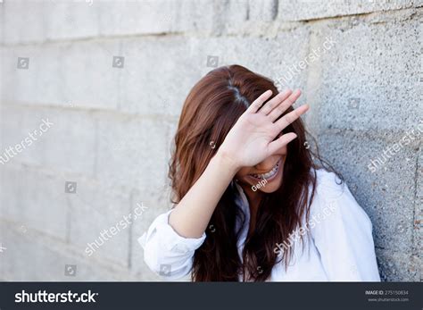 Shy Brunette Girl Covering Her Face Stock Photo Shutterstock