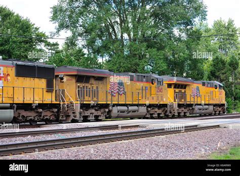 Multiple locomotive units head a Union Pacific freight train through ...