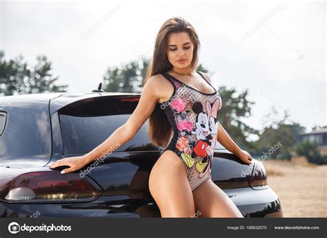 Brunette Woman Posing Near The Car Stock Photo Schummyone