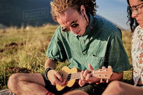 Cheerful Friendly People Playing Ukulele While Entertaining During