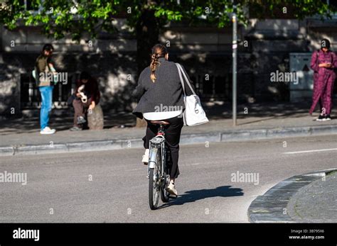 female student cycling   mathieu de layens square  plein