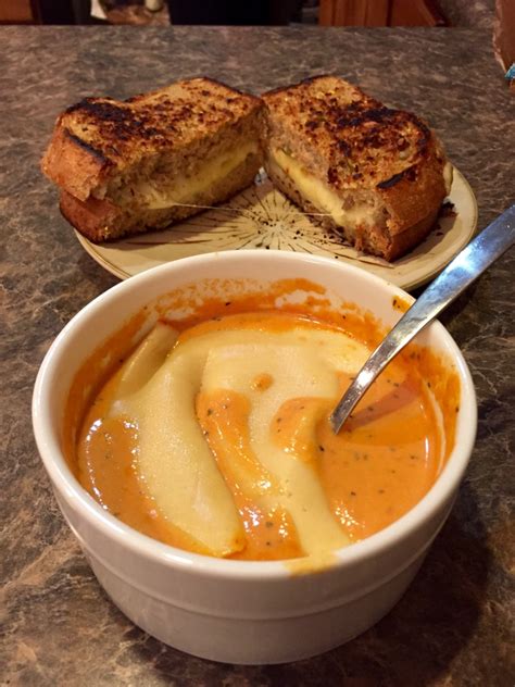 Grilled Cheese On 12 Grain Wheat Bread To Dip In Tomato Basil Soup With A Slice Of Muenster