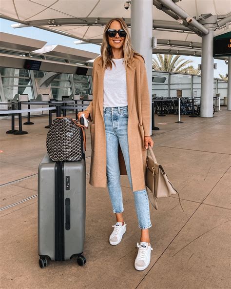 Travel Outfit What To Wear To The Airport Camel Coat Outfit Blue