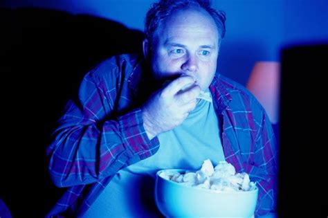 Man Eating Crisps