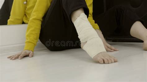 Close Up Woman Bandaging Her Leg With Elastic Bandage Action Stock