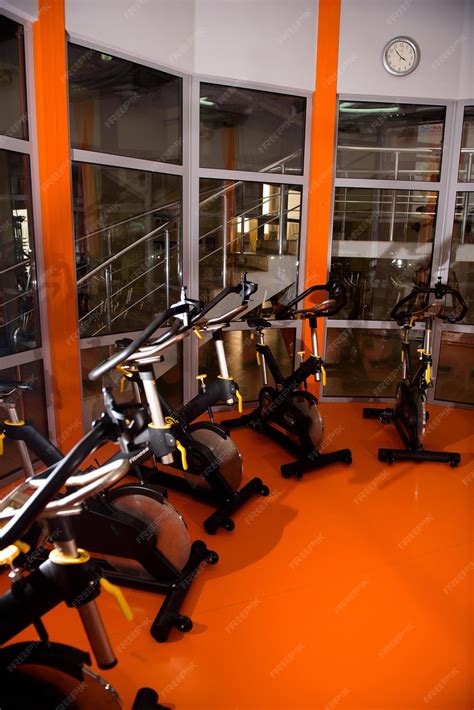 Premium Photo | Rows of stationary bike in gym modern fitness center
