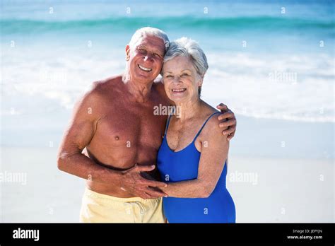 Cute Mature Couple Hugging On The Beach Stock Photo Alamy