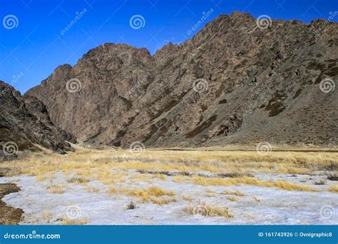 Snowy Grass Field At The Entrance Of The Yolyn Am Or Yoliin Am Canyon