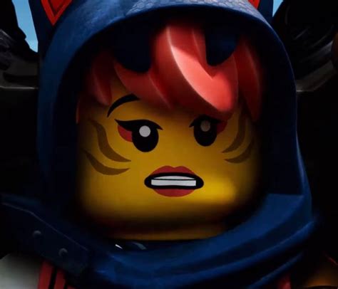 a lego character with red hair wearing a blue hoodie and an evil look on his face