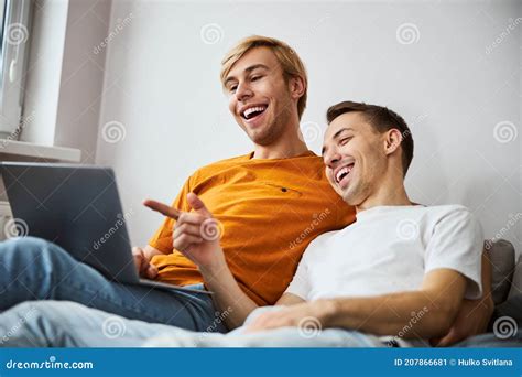 Happy Gay Couple Watching Movie On Laptop At Home Stock Image Image Of Home Internet