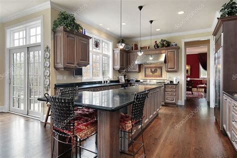 Elegant kitchen with black marble island — Stock Photo © lmphot #8694865