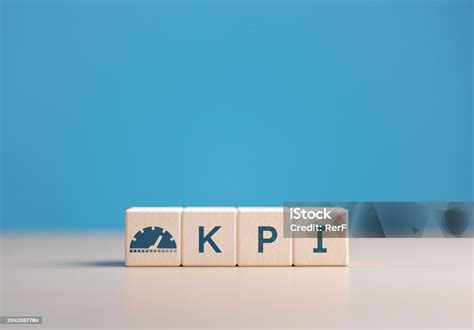 Wooden Cubes With A Kpi Word And Icons Key Performance Indicator