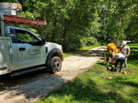 crew installing underground fiber drop – South Central Indiana REMC