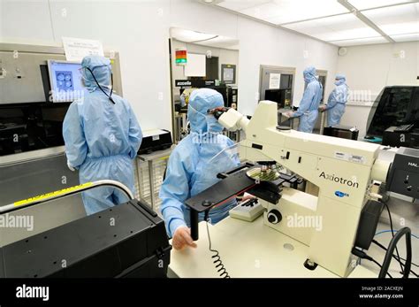 Silicon Wafer Research Researchers Working In A Clean Room To Develop