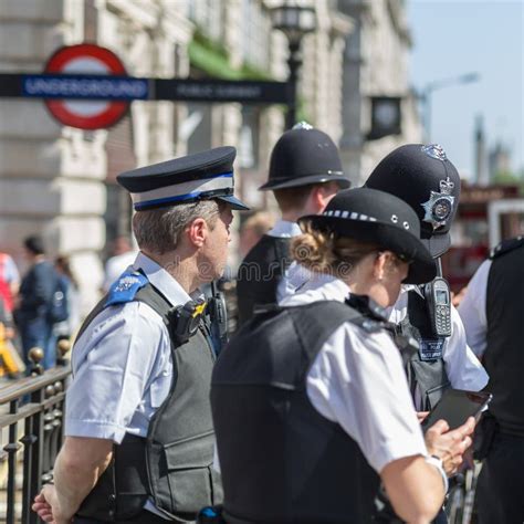 Street Photography Group Of London Policemen With Their Uniform