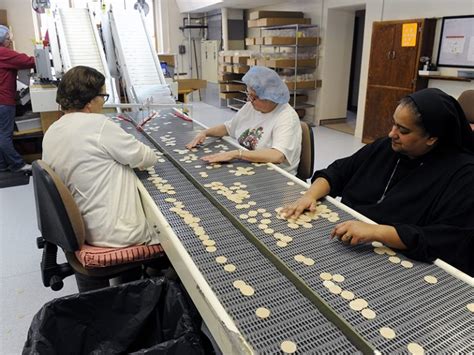 Web Sister Lynn Marie Dsouza Helps Sort Regular Communion Wafers At