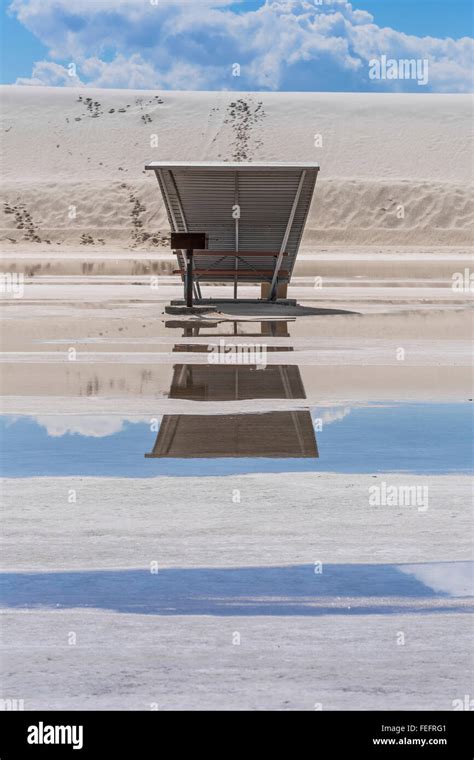 Space Age Picnic Shelters Reflecting In Pond From Recent Heavy Rains In