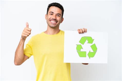 Jovem Bonito Sobre Fundo Branco Isolado Segurando Um Cartaz O