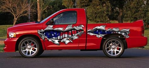 A Red Truck With An American Flag Painted On It S Side