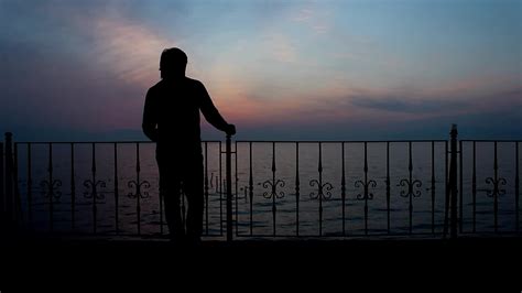 Thoughtful alone man silhouette with seaview 23220871 Stock Video at Vecteezy