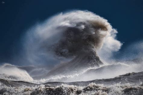 photographer captures dramatic human face  wave   great lakes