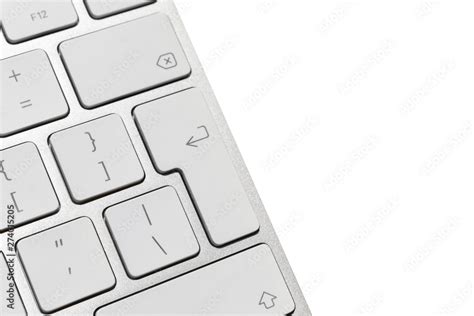 big enter key on the white wireless computer keyboard, isolated on ...