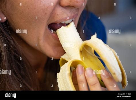 Woman Eats Food Woman Eats Banana Close Shot Of Girl Eating Bananas