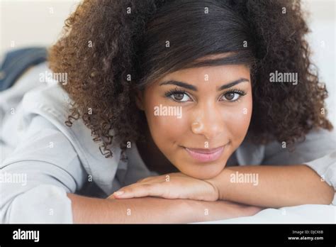 Pretty Happy Brunette Lying On Bed Resting Head On Hand Stock Photo Alamy