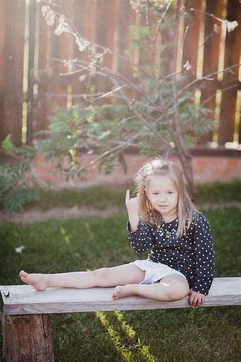 "Little Girl Sitting On The Bench" by Stocksy Contributor "Irina ...