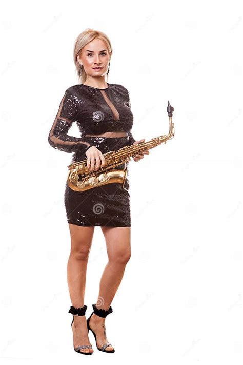 Attractive Saxophonist Woman Playing At Her Musical Instrument Stock