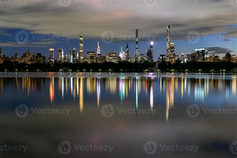 Manhattan Skyline view at night from Central Park across the Central ...