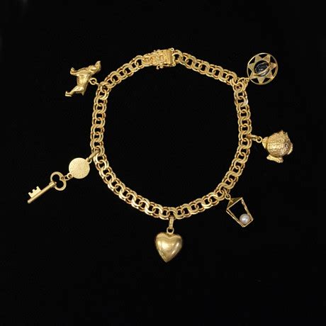 ARMBAND BISMARCK K GULD SAMT SEX BERLOCKER K GULD Smycken Ädelstenar Armband Auctionet