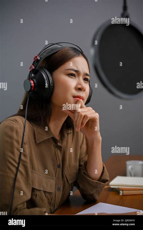 Portrait Professional And Talented Young Asian Female Radio Host Using