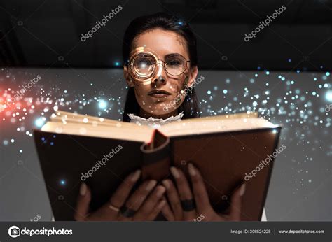 Low Angle View Steampunk Woman Glasses Reading Book Glowing