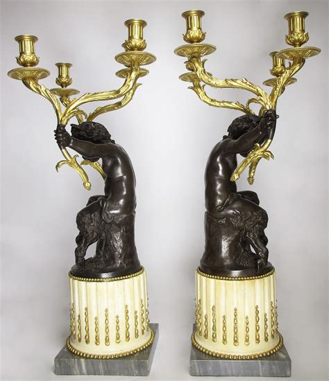 A Fine Pair Of French Th Century Gilt Bronze And Patinated Bronze